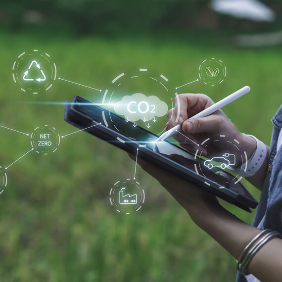 Close up of hands holding and writing on a tablet
