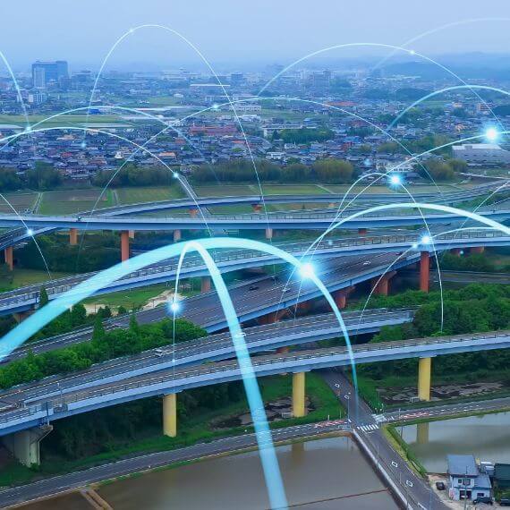 Aerial view of a city with connecting arcs and nodes overlay